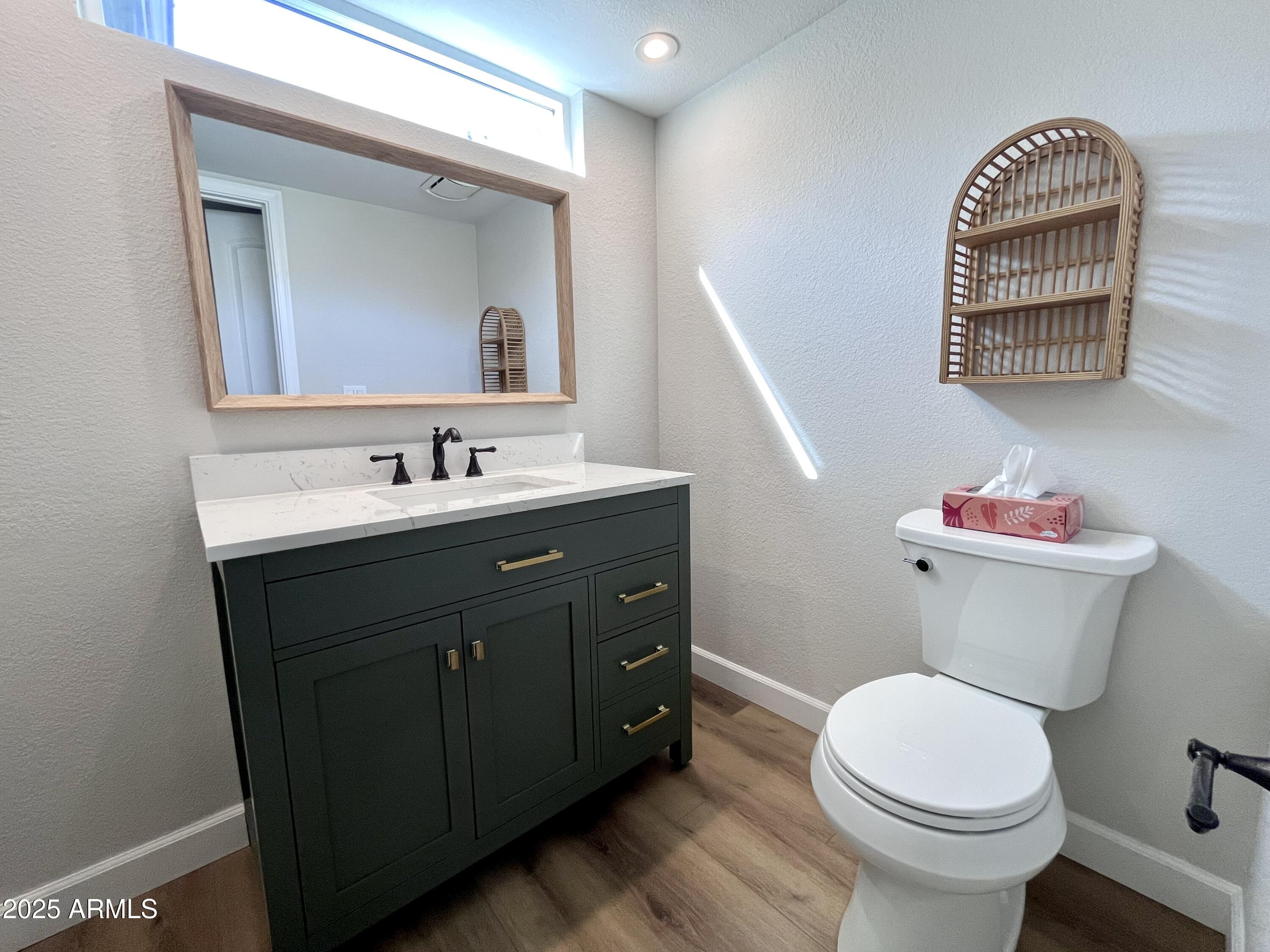 4924 East Hillery Drive Scottsdale, AZ 85254 - Photo 11 of 24 a bathroom with a sink vanity mirror and toilet