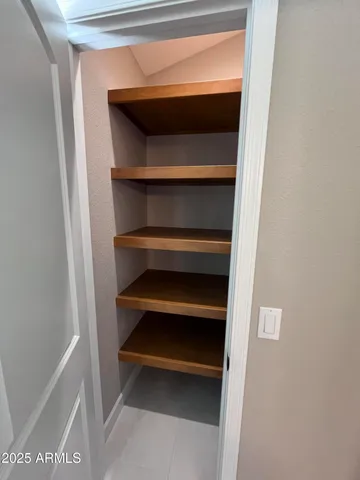 a view of an empty walk in closet