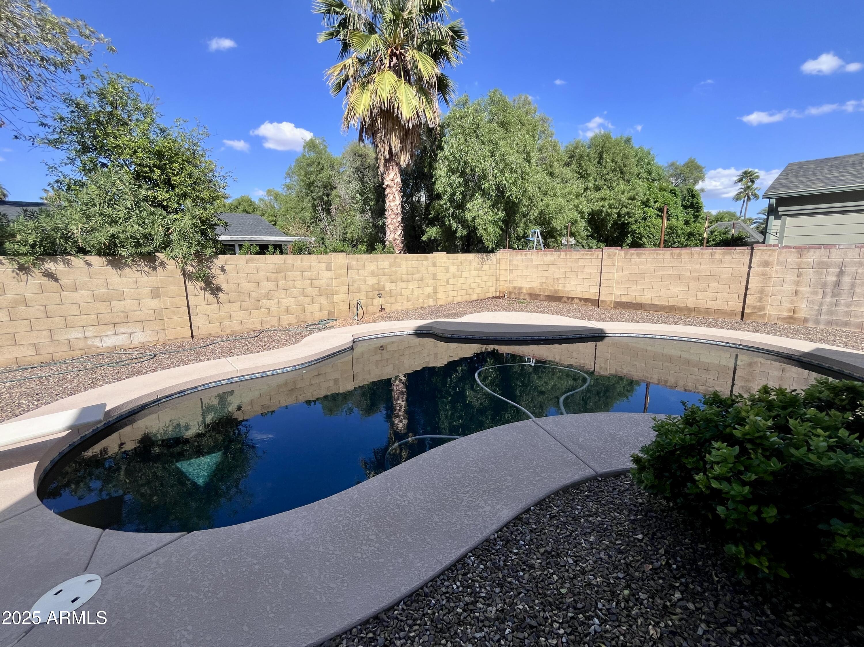 4924 East Hillery Drive Scottsdale, AZ 85254 - Photo 7 of 24 a view of a swimming pool with a patio