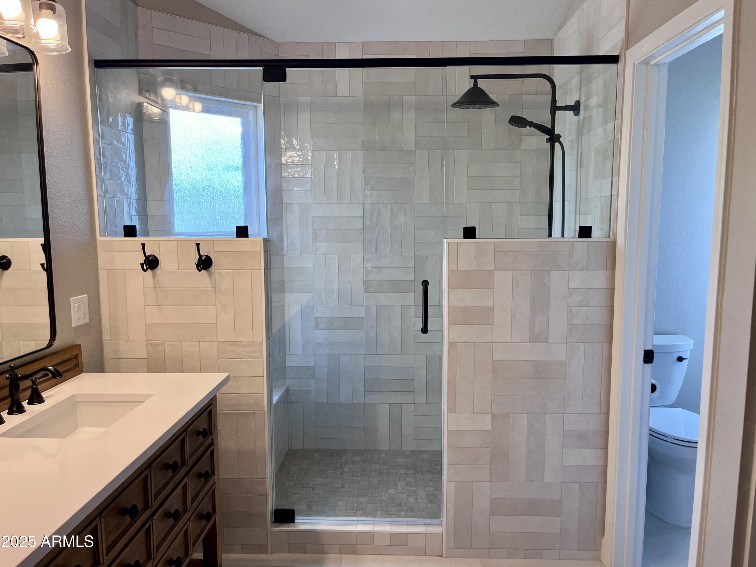 4924 East Hillery Drive Scottsdale, AZ 85254 - Photo 8 of 24 a bathroom with a granite countertop shower sink and mirror