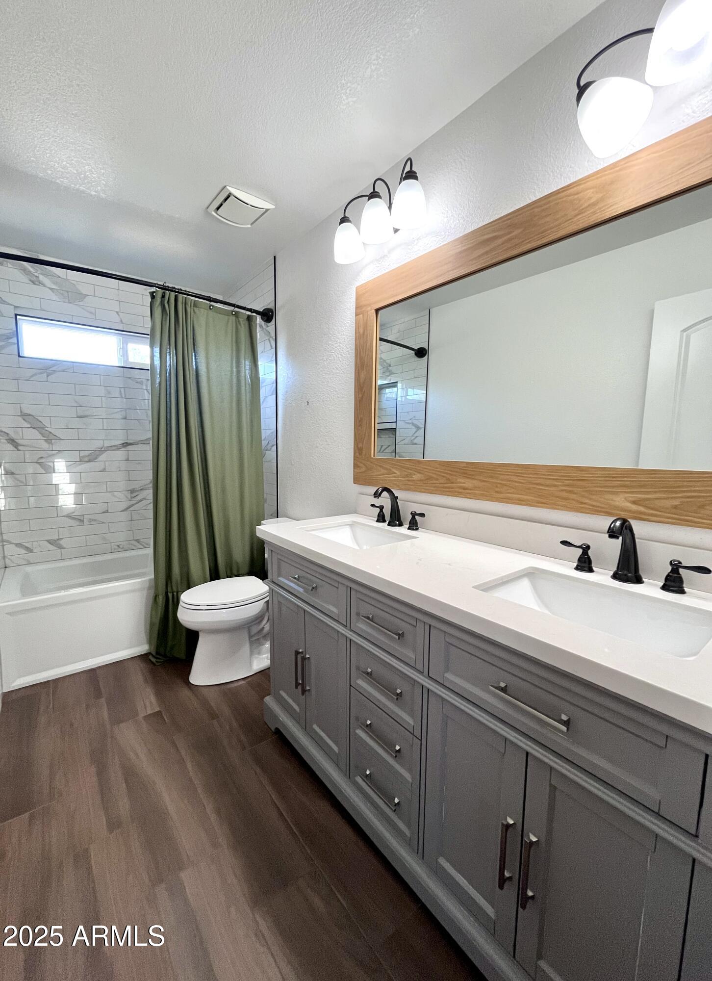 4924 East Hillery Drive Scottsdale, AZ 85254 - Photo 10 of 24 a spacious bathroom with double vanity and a large mirror