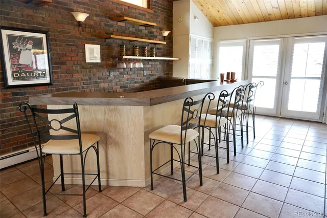 a view of a chairs and table in a patio