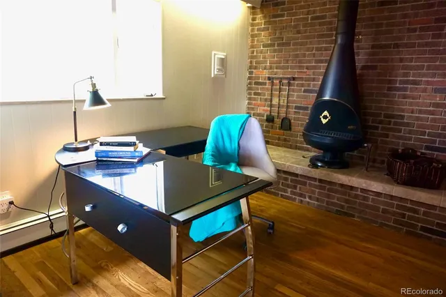 a view of a workspace with furniture