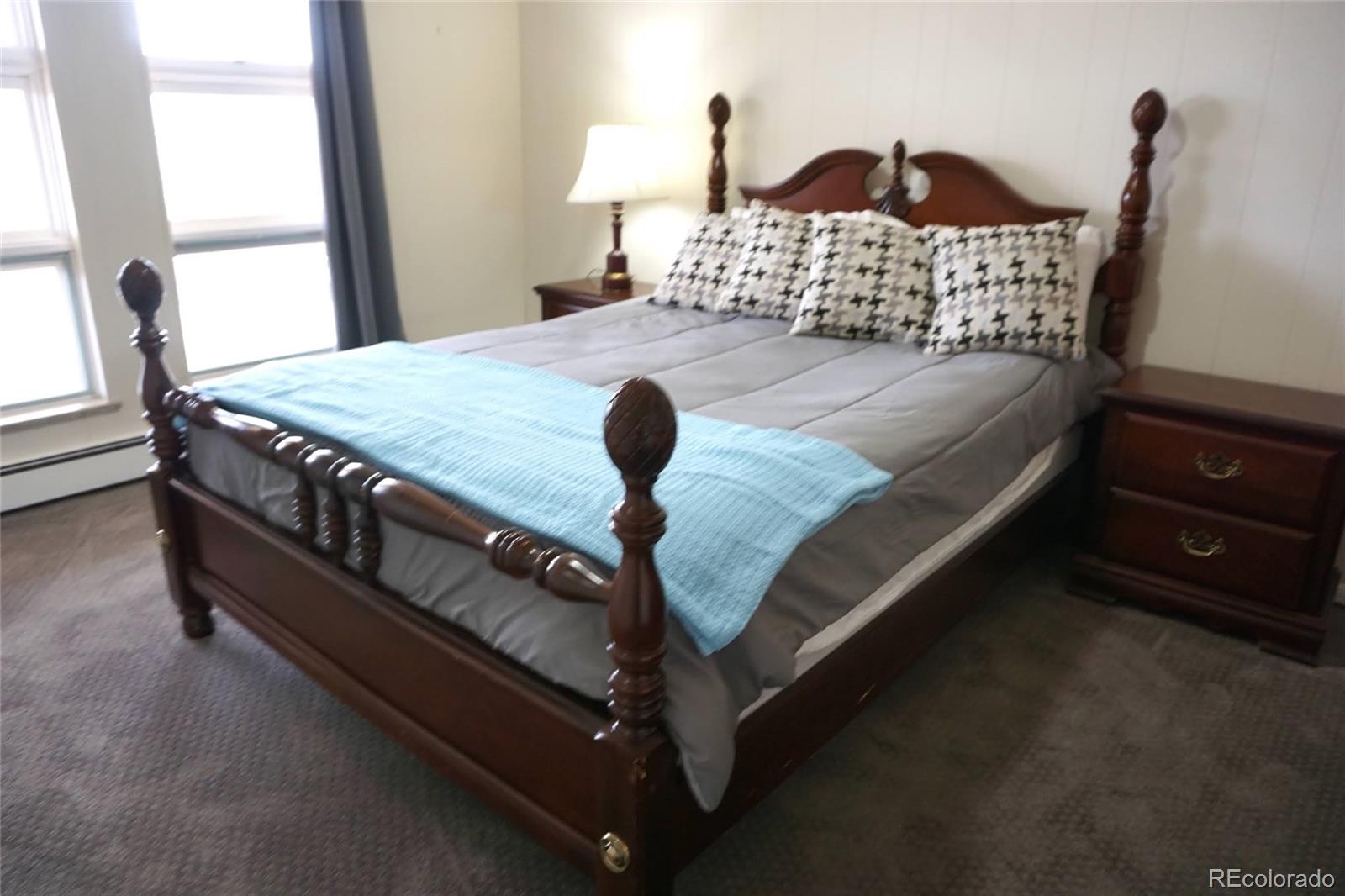 919 Park Street Trinidad, CO 81082 - Photo 33 of 47 a bedroom with a bed and a dresser in it