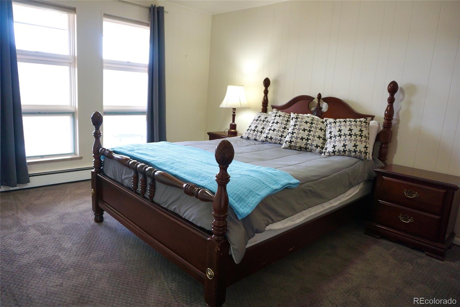 919 Park Street Trinidad, CO 81082 - Photo 34 of 47 a bedroom with a bed and window