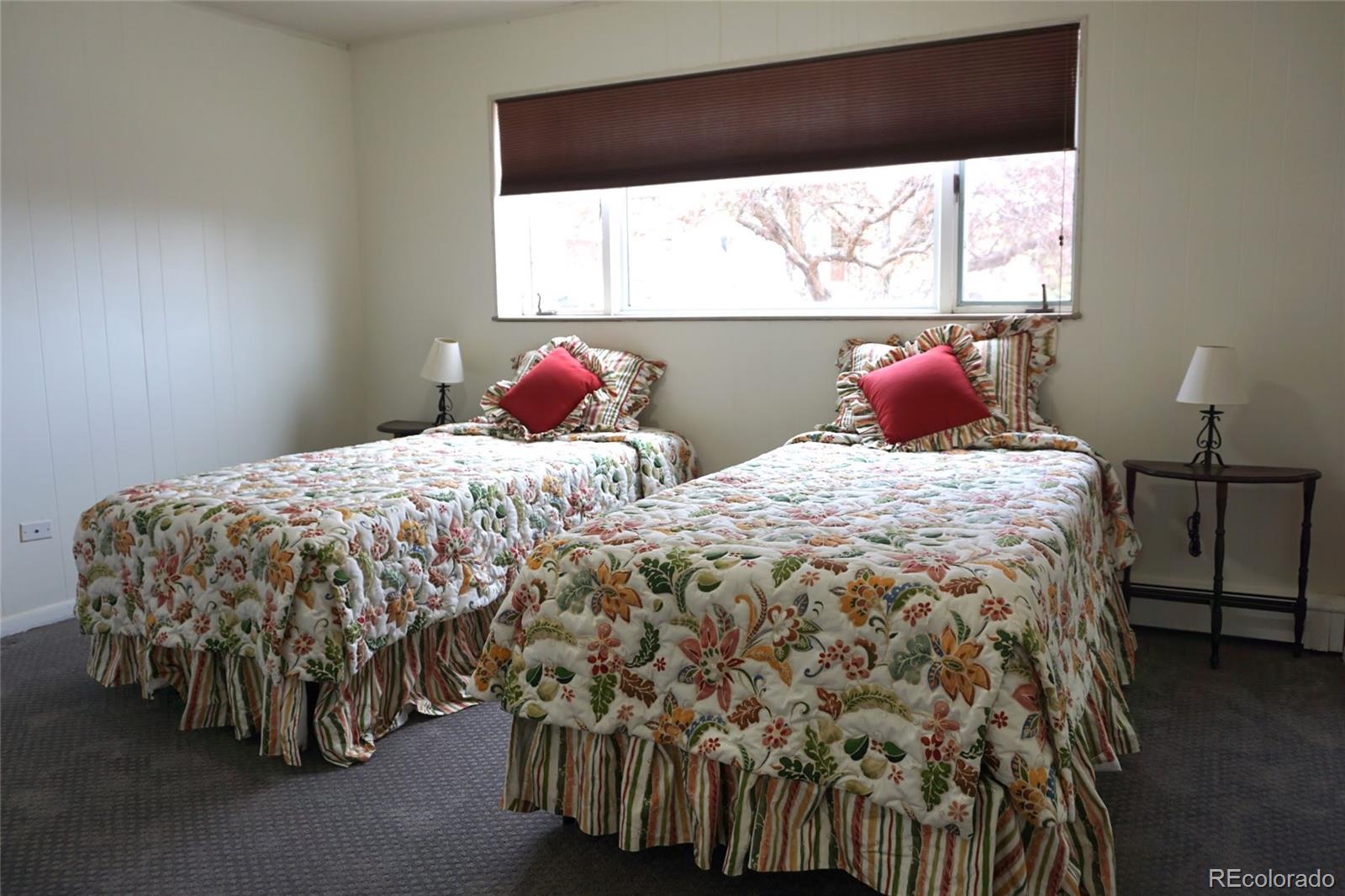 919 Park Street Trinidad, CO 81082 - Photo 36 of 47 a bed sitting in a bedroom next to a window