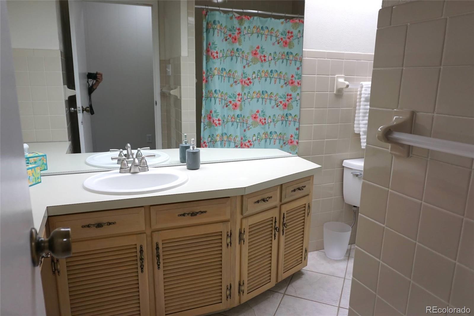 919 Park Street Trinidad, CO 81082 - Photo 37 of 47 a bathroom with a sink a vanity and a mirror