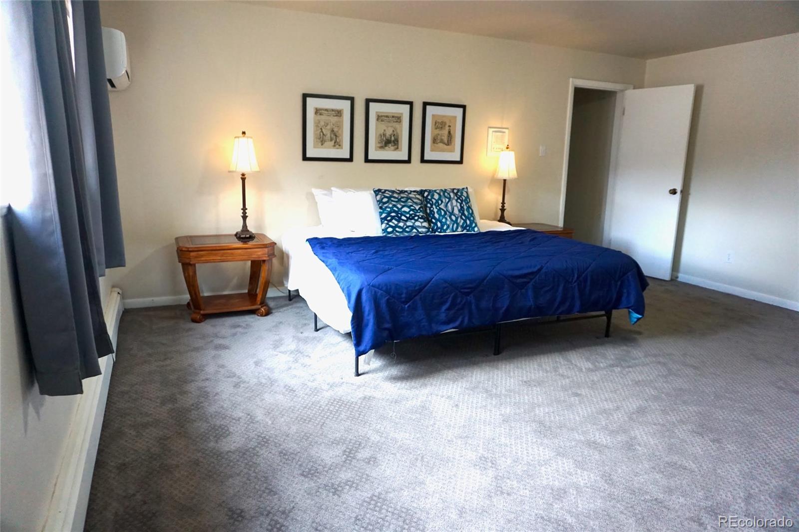 919 Park Street Trinidad, CO 81082 - Photo 41 of 47 a spacious bedroom with a bed and a couch