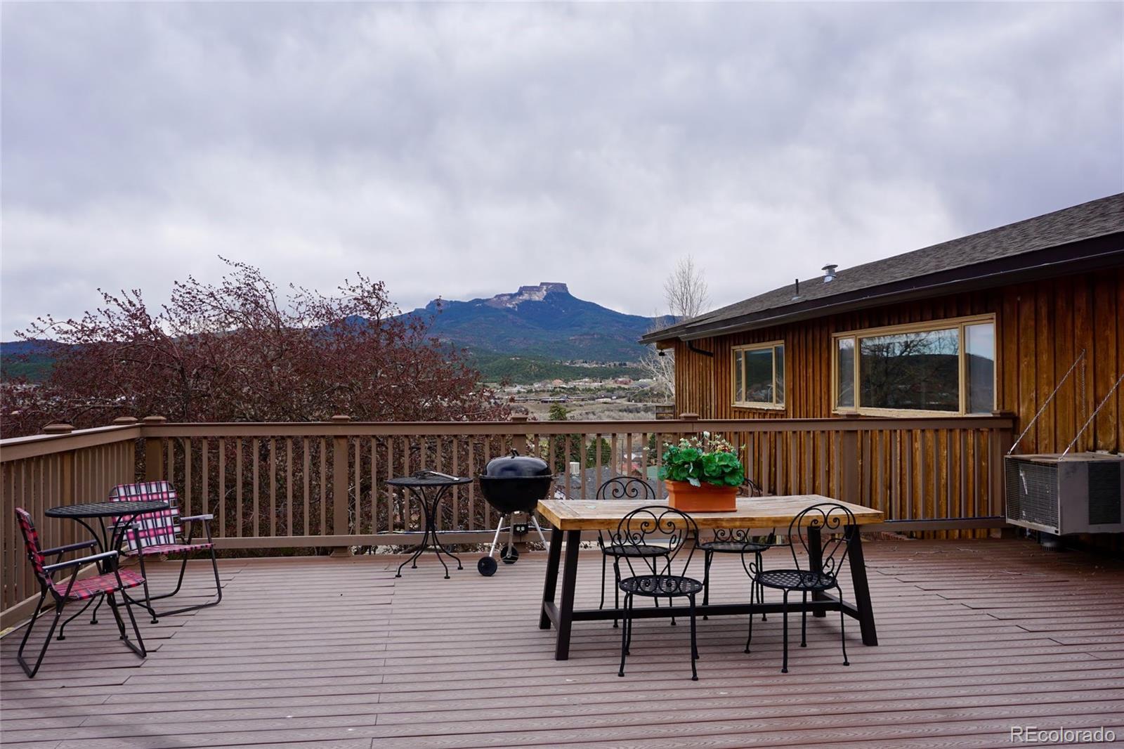 919 Park Street Trinidad, CO 81082 - Photo 44 of 47 a view of a patio with a table and chairs