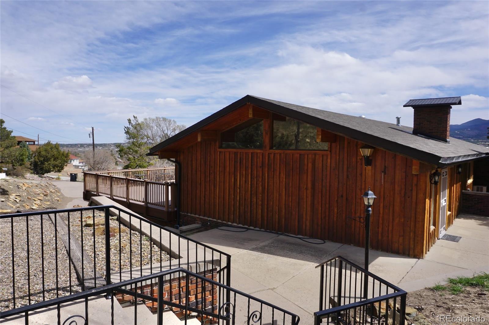 919 Park Street Trinidad, CO 81082 - Photo 5 of 47 a view of a wooden house with large windows