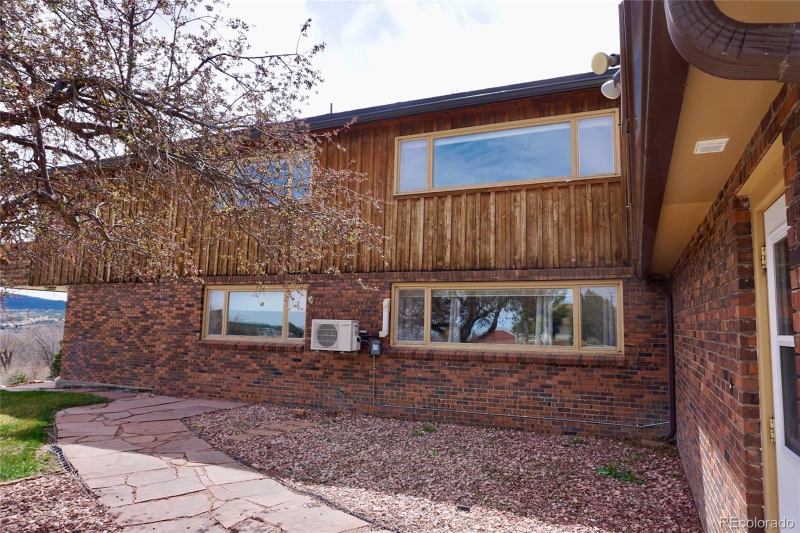 919 Park Street Trinidad, CO 81082 - Photo 6 of 47 a view of a brick house with large windows