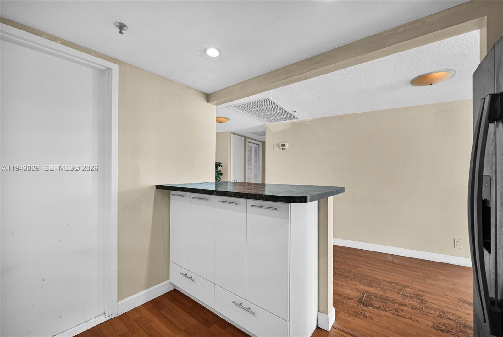900 Bay Drive, Unit 321 Miami Beach, FL 33141 - Photo 13 of 67 a view of storage and utility room in wooden floor