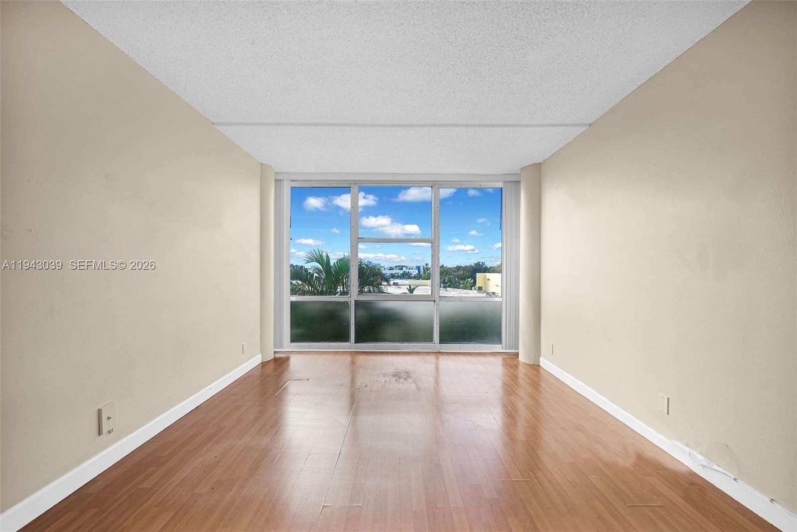 900 Bay Drive, Unit 321 Miami Beach, FL 33141 - Photo 15 of 67 a view of a glass door and wooden floor