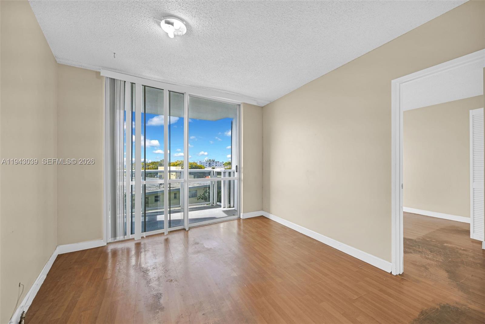 900 Bay Drive, Unit 321 Miami Beach, FL 33141 - Photo 16 of 67 a view of a room with wooden floor