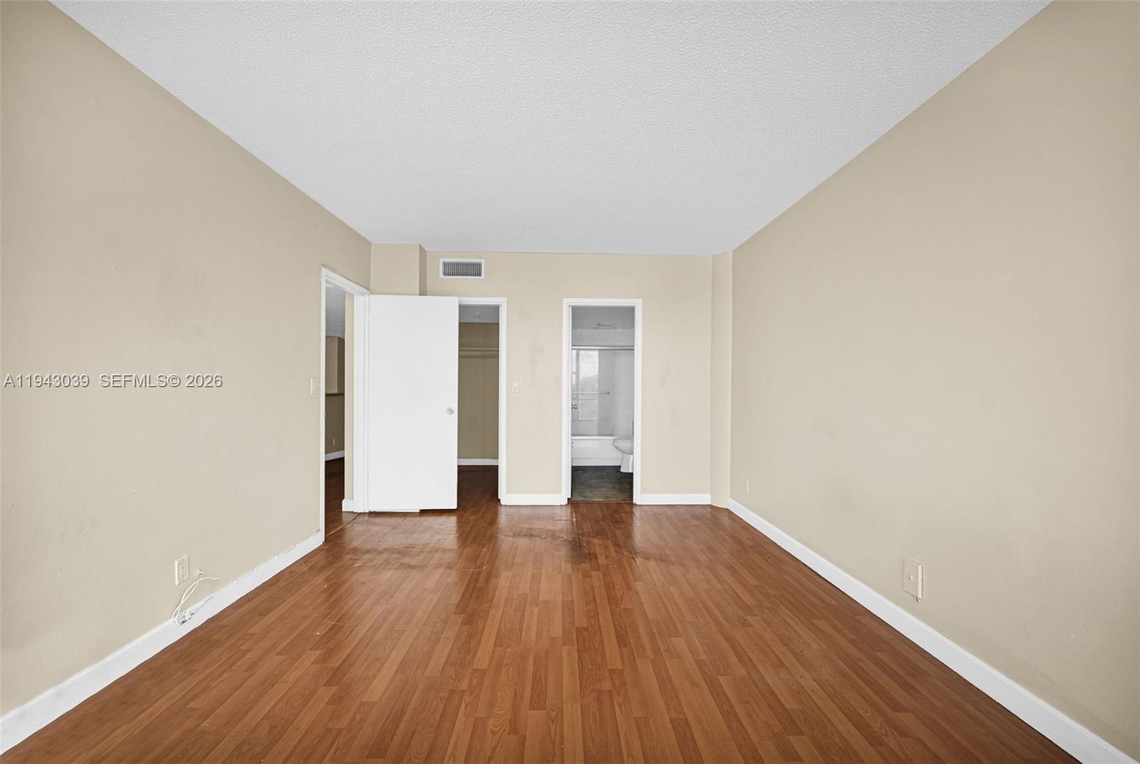 900 Bay Drive, Unit 321 Miami Beach, FL 33141 - Photo 25 of 67 a view of an empty room with wooden floor