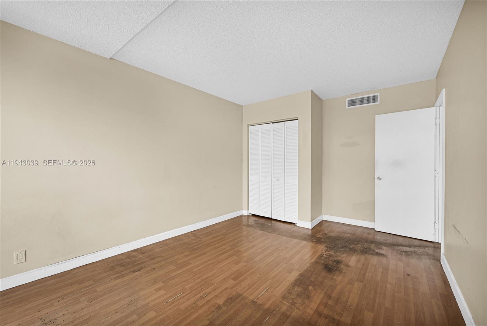 900 Bay Drive, Unit 321 Miami Beach, FL 33141 - Photo 26 of 67 a view of an empty room with wooden floor