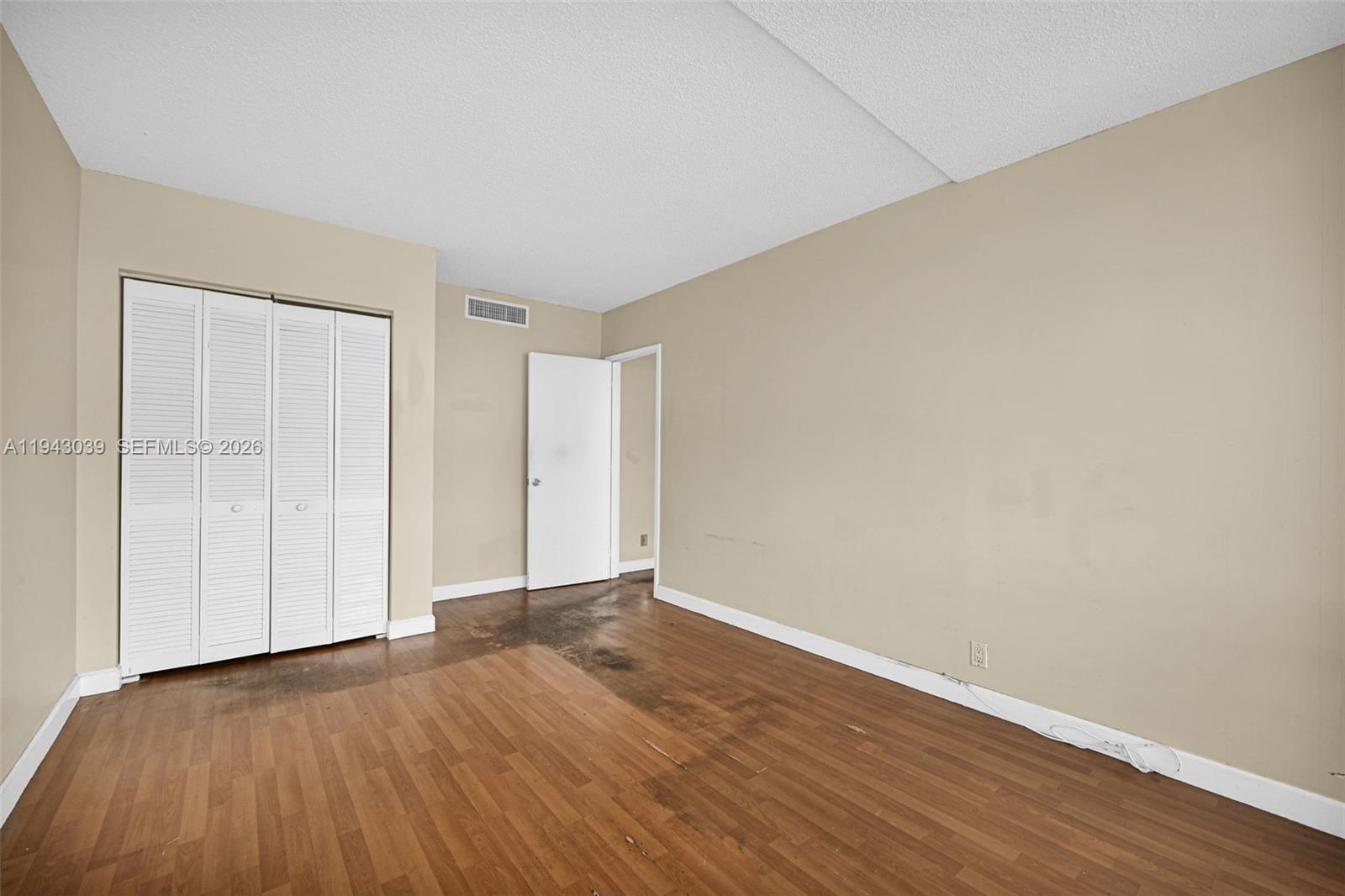 900 Bay Drive, Unit 321 Miami Beach, FL 33141 - Photo 28 of 67 a view of an empty room with wooden floor