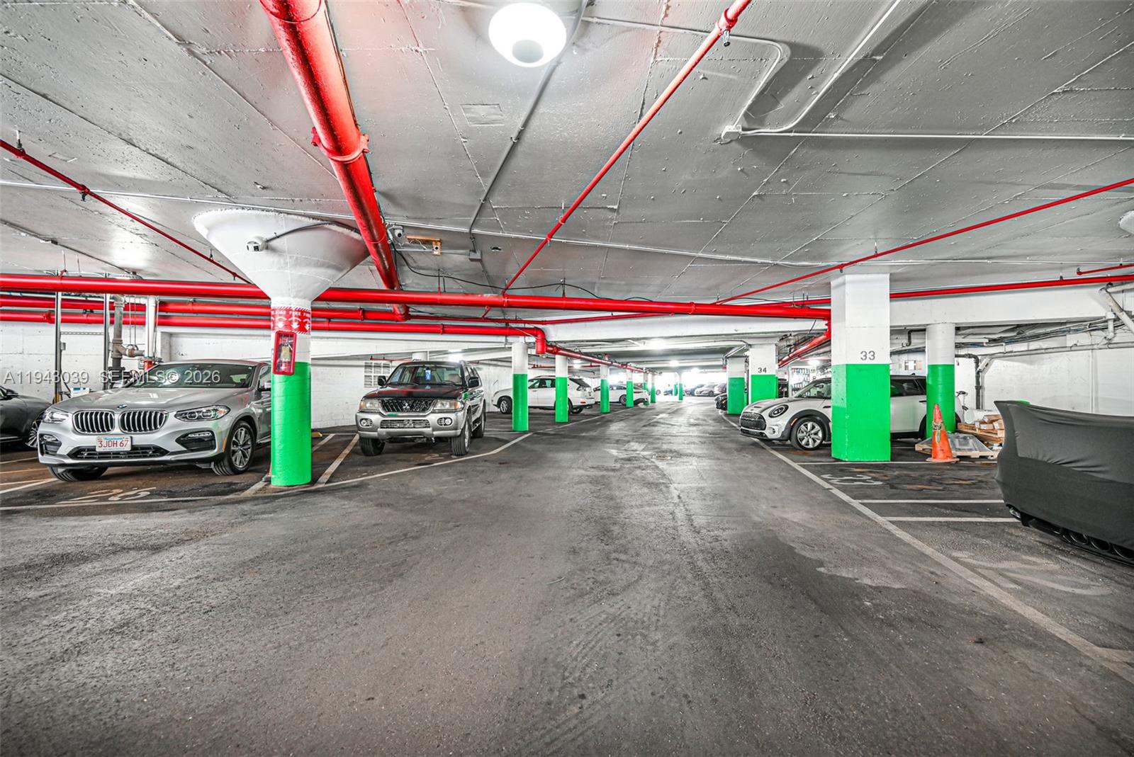 900 Bay Drive, Unit 321 Miami Beach, FL 33141 - Photo 36 of 67 a view of a garage with a table and chairs