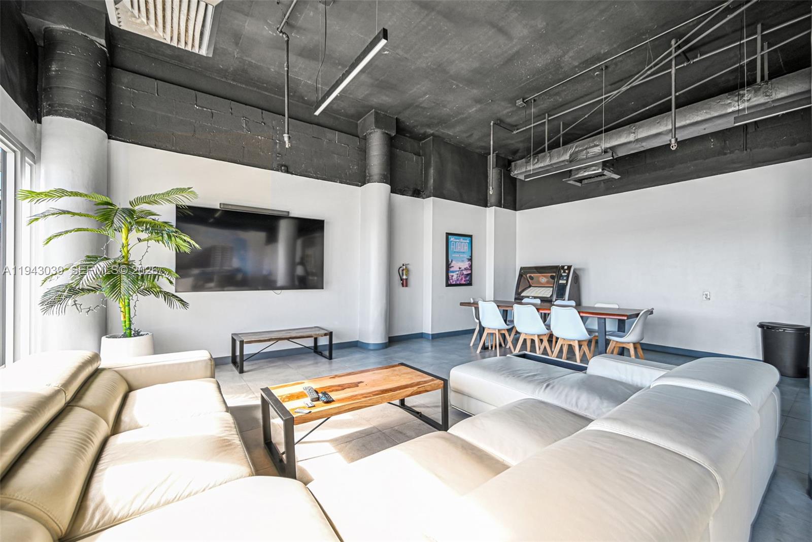 900 Bay Drive, Unit 321 Miami Beach, FL 33141 - Photo 39 of 67 a living room with furniture