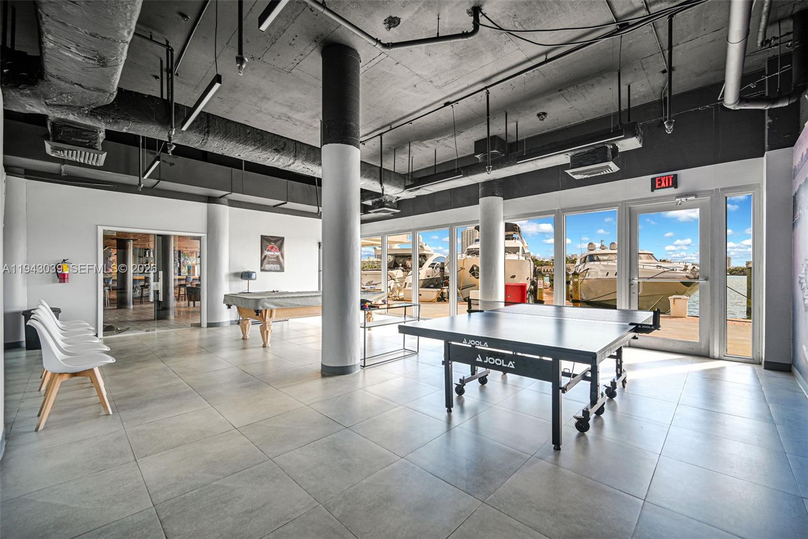 900 Bay Drive, Unit 321 Miami Beach, FL 33141 - Photo 42 of 67 a room with lots of table and chairs