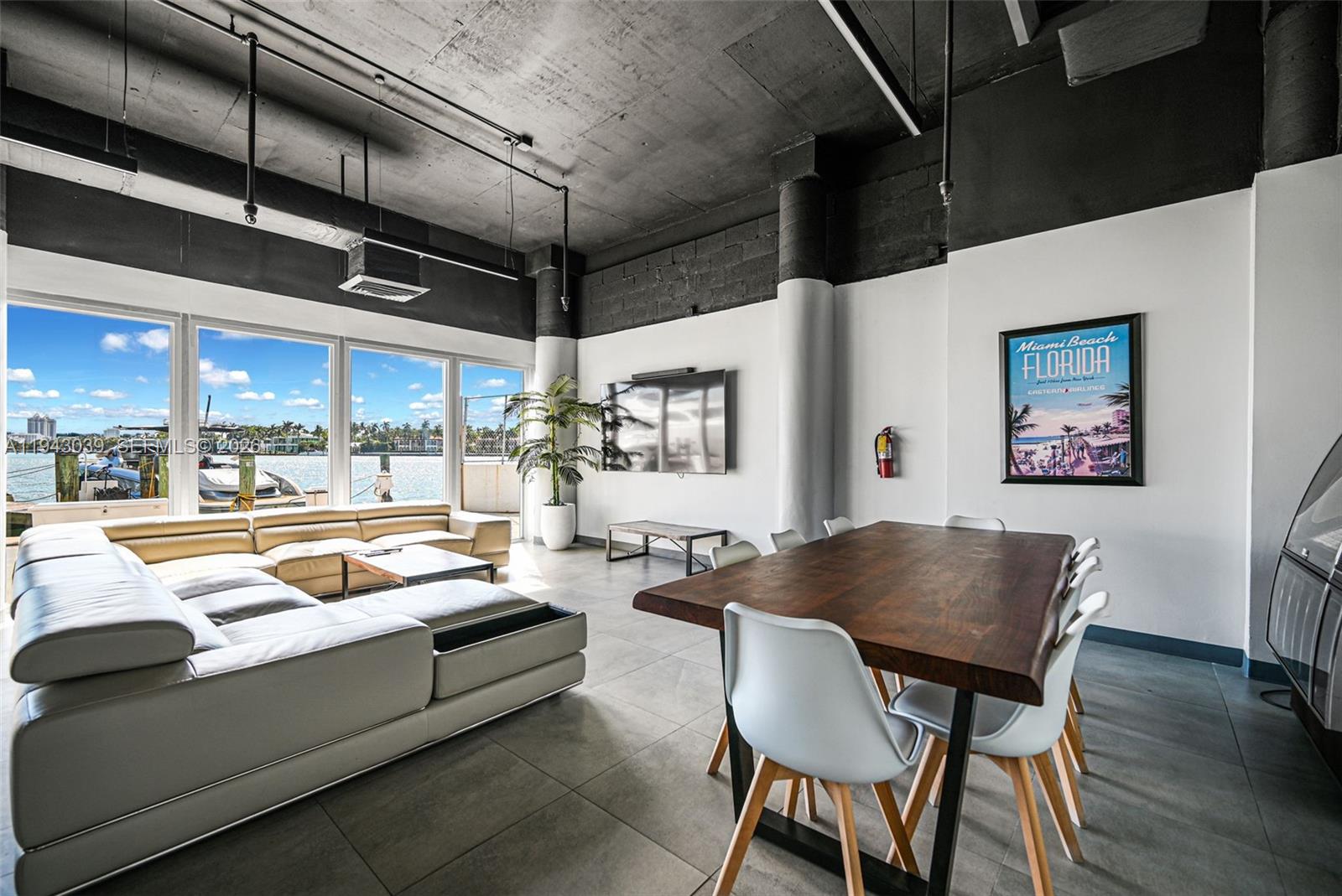 900 Bay Drive, Unit 321 Miami Beach, FL 33141 - Photo 44 of 67 a living room with furniture and a large window