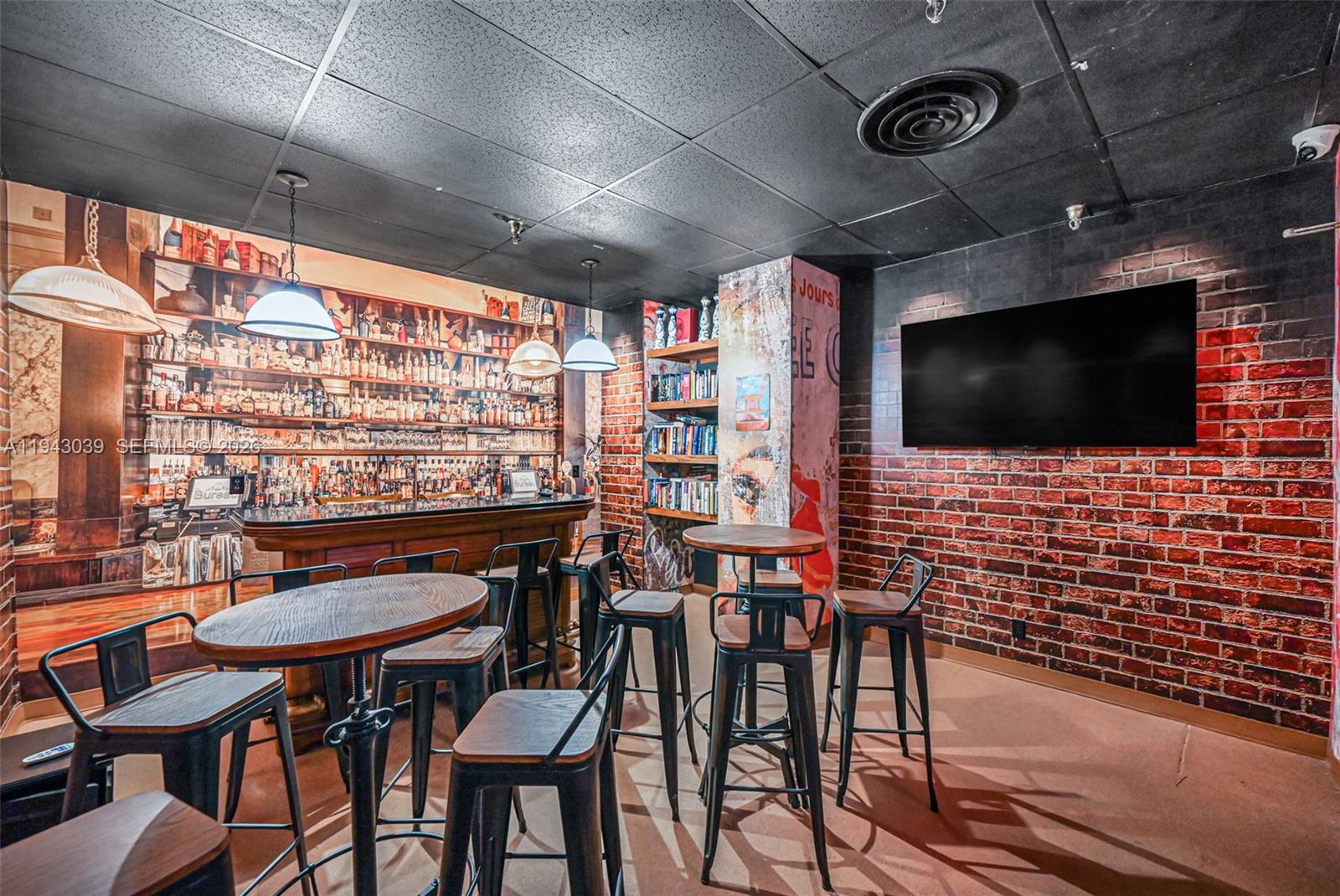 900 Bay Drive, Unit 321 Miami Beach, FL 33141 - Photo 45 of 67 a view of a livingroom with furniture and a flat screen tv