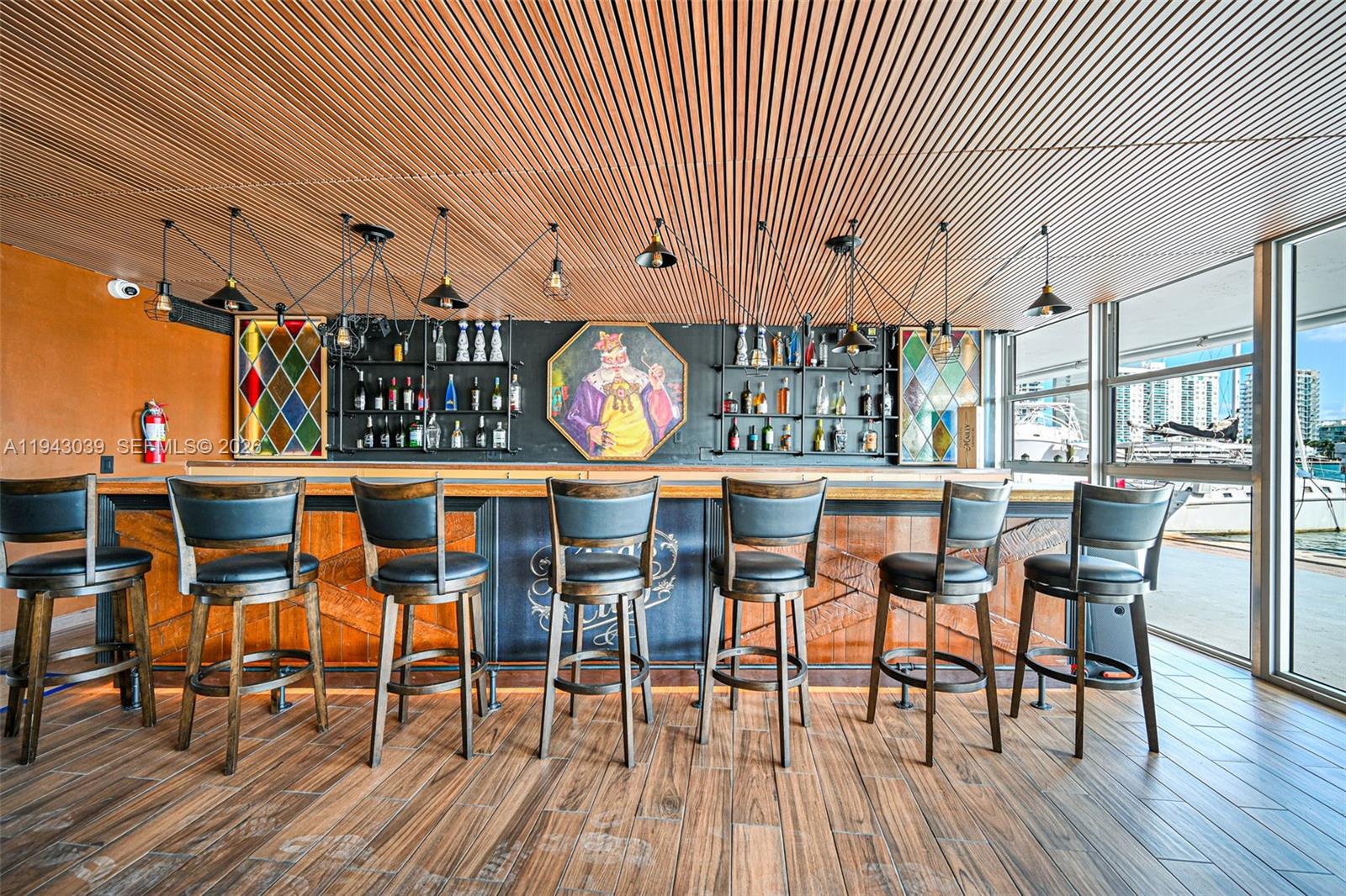 900 Bay Drive, Unit 321 Miami Beach, FL 33141 - Photo 46 of 67 a dining room with furniture and wooden floor