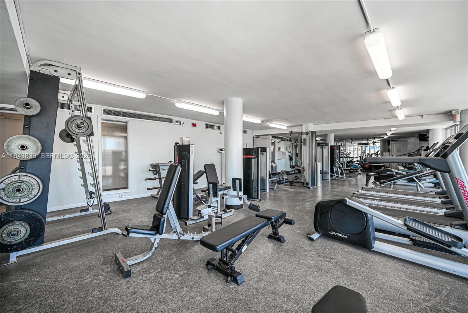 900 Bay Drive, Unit 321 Miami Beach, FL 33141 - Photo 48 of 67 a view of a room with gym equipment