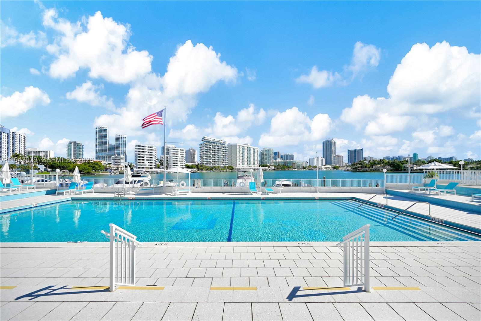 900 Bay Drive, Unit 321 Miami Beach, FL 33141 - Photo 52 of 67 a view of a swimming pool and a terrace