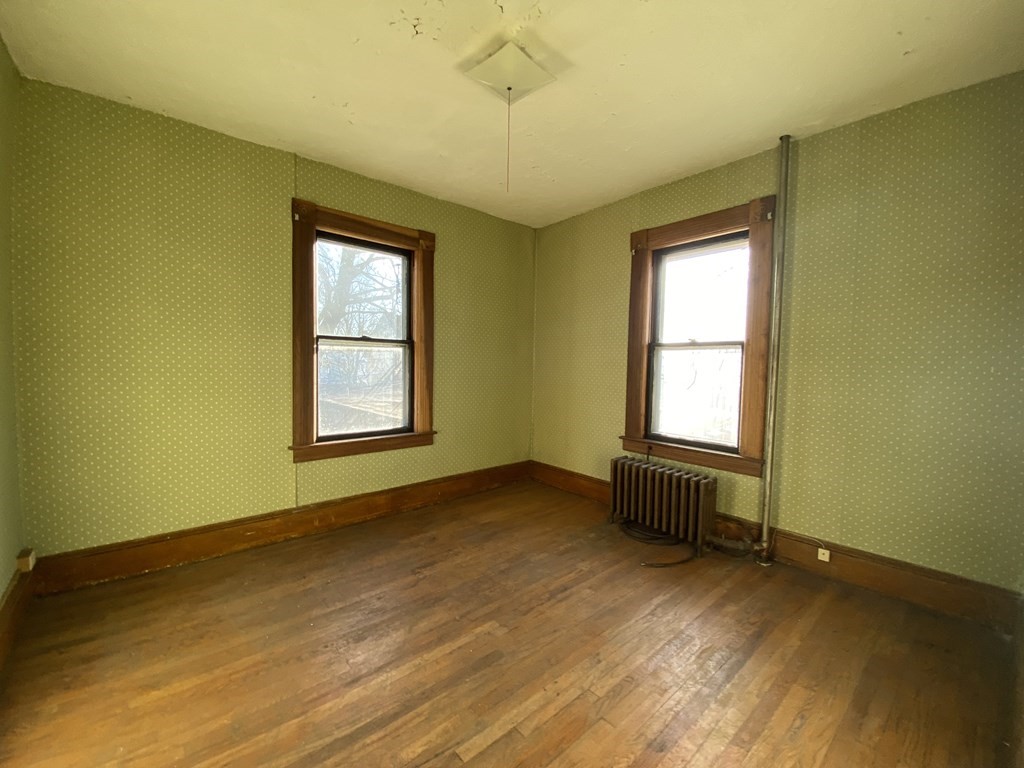 231 Orange Street Springfield, MA 01108 - Photo 15 of 22 a view of an empty room with a window