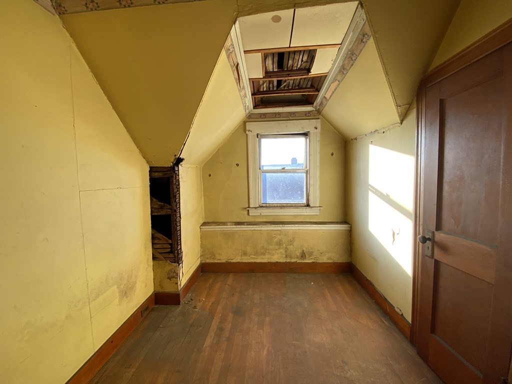 231 Orange Street Springfield, MA 01108 - Photo 18 of 22 a view of entryway and hall with wooden floor