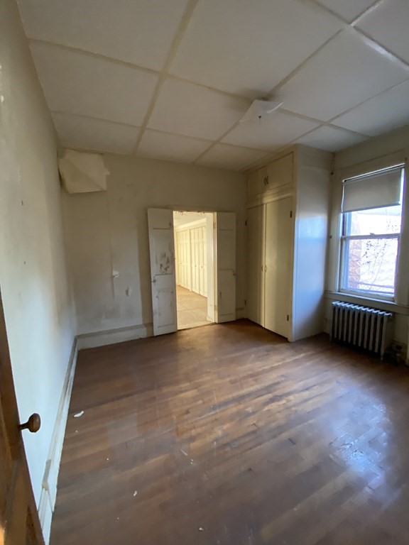 231 Orange Street Springfield, MA 01108 - Photo 5 of 22 an empty room with windows