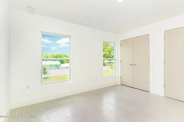 an empty room with windows