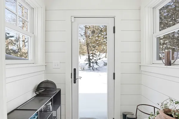 a white bath tub sitting next to a window