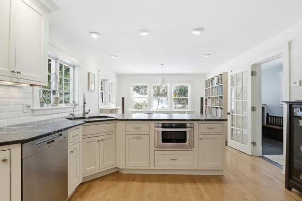 a view of a dining room with furniture and wooden floor