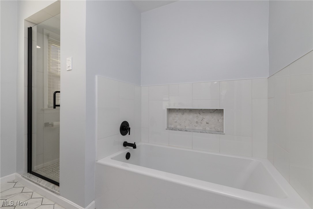 2536 Traymore Road Cleveland, OH 44118 - Photo 21 of 29 Bathroom with independent shower and bath and tile patterned floors
