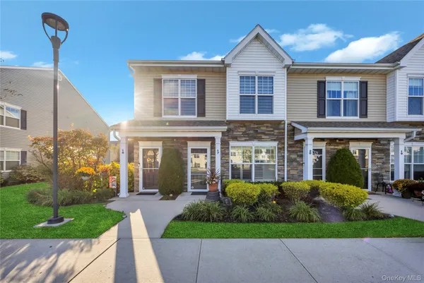 a view of a house with a yard and plants