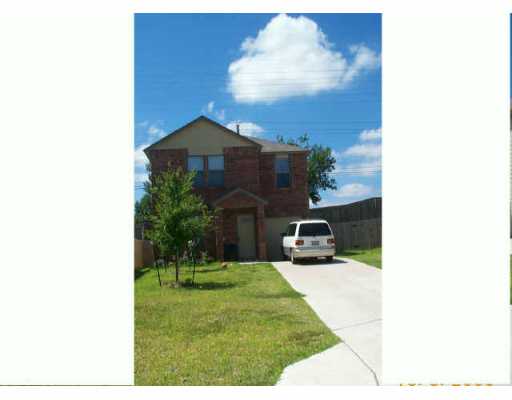 13638 Merseyside Drive Pflugerville, TX 78660 - Photo 1 of 1 a living room with furniture and a fireplace