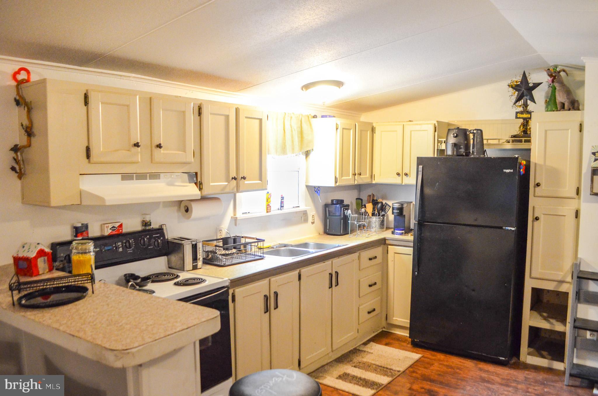 2001 Red Bank Road Dover, PA 17315 - Photo 9 of 19 a kitchen with a refrigerator and a stove top oven