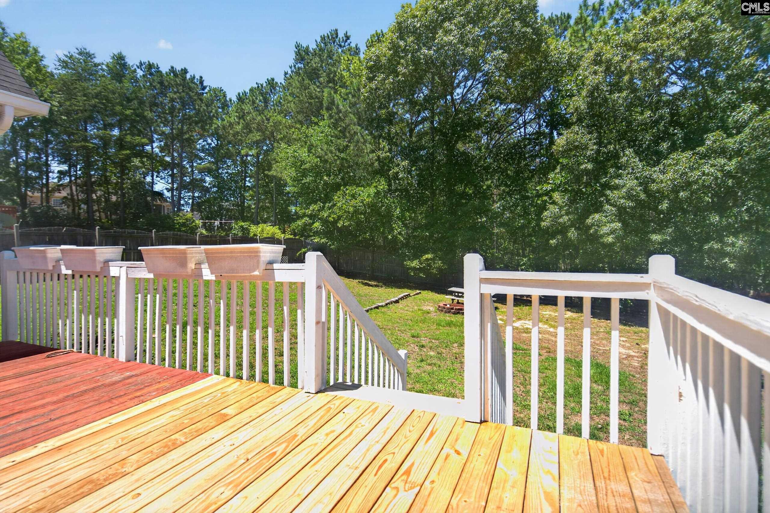 219 Plantation Pointe Drive Elgin, SC 29045 - Photo 41 of 56 a balcony with wooden floor and fence
