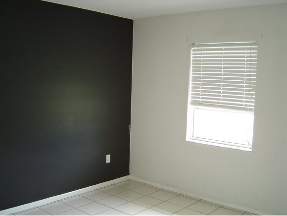 759 Northeast Apollo Palm Bay, FL 32905 - Photo 6 of 12 an empty room with a window