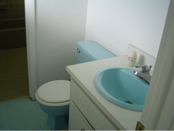 759 Northeast Apollo Palm Bay, FL 32905 - Photo 7 of 12 a bathroom with a toilet and a sink