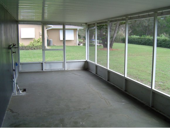 759 Northeast Apollo Palm Bay, FL 32905 - Photo 10 of 12 a view of an empty room with windows and balcony