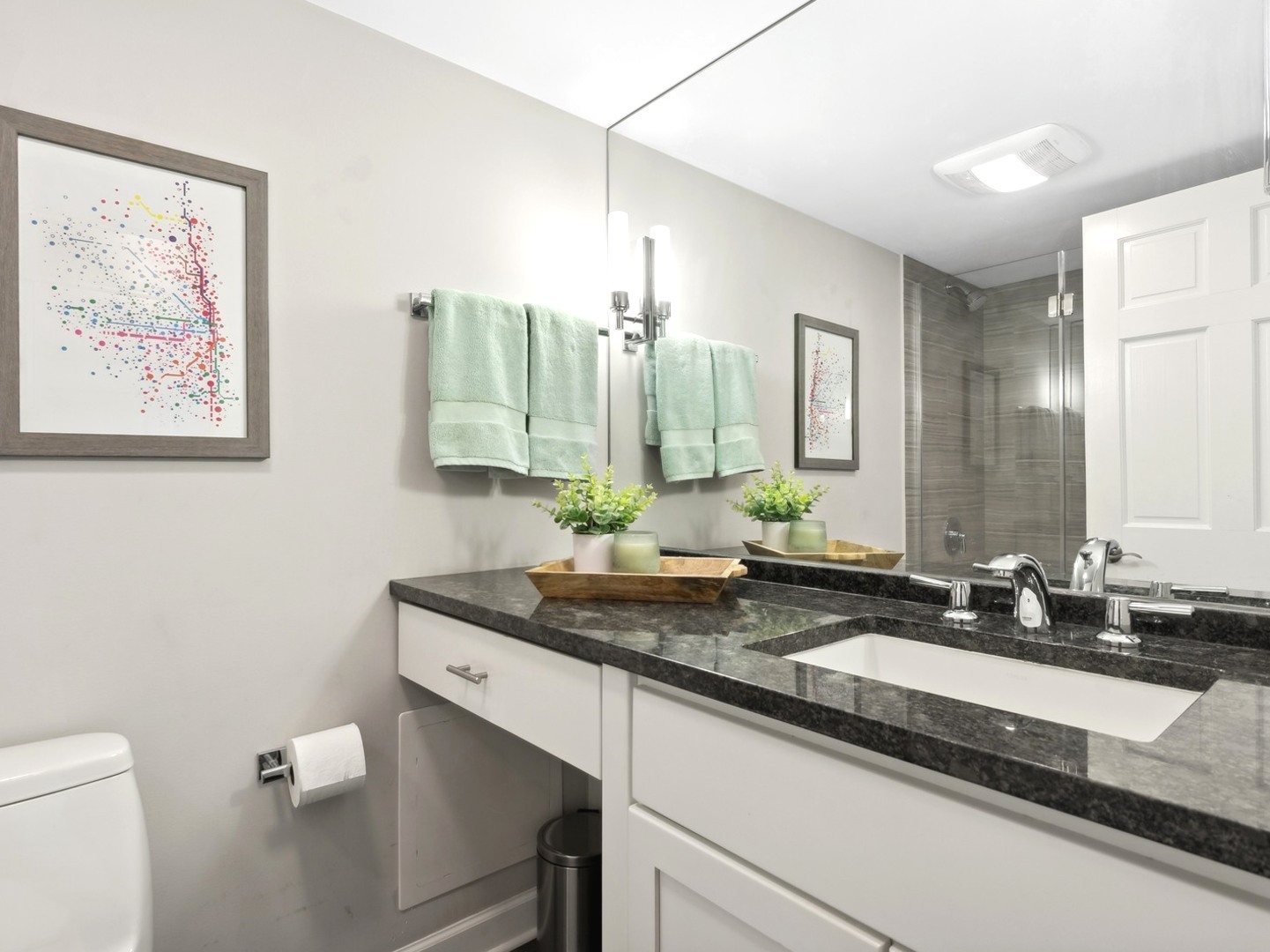 2333 North Geneva Terrace, Unit 6D Chicago, IL 60614 - Photo 12 of 15 a bathroom with a double vanity sink and a mirror