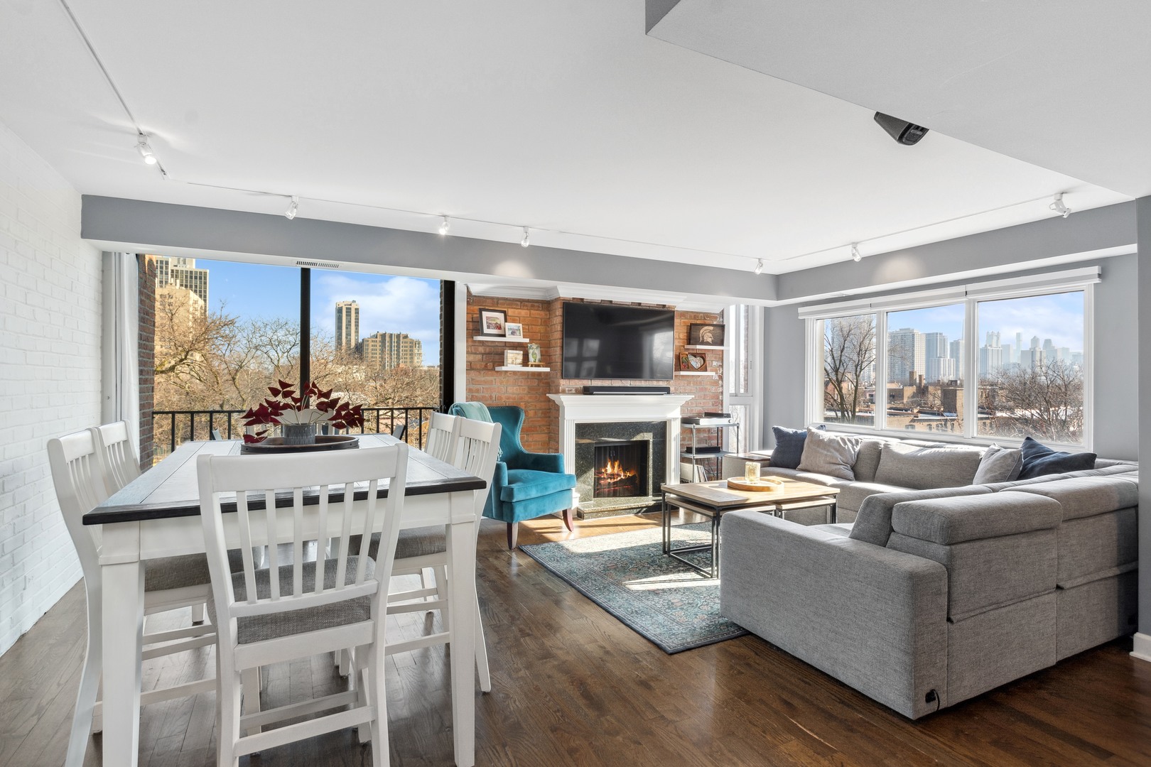 2333 North Geneva Terrace, Unit 6D Chicago, IL 60614 - Photo 2 of 15 a living room with fireplace furniture and a large window