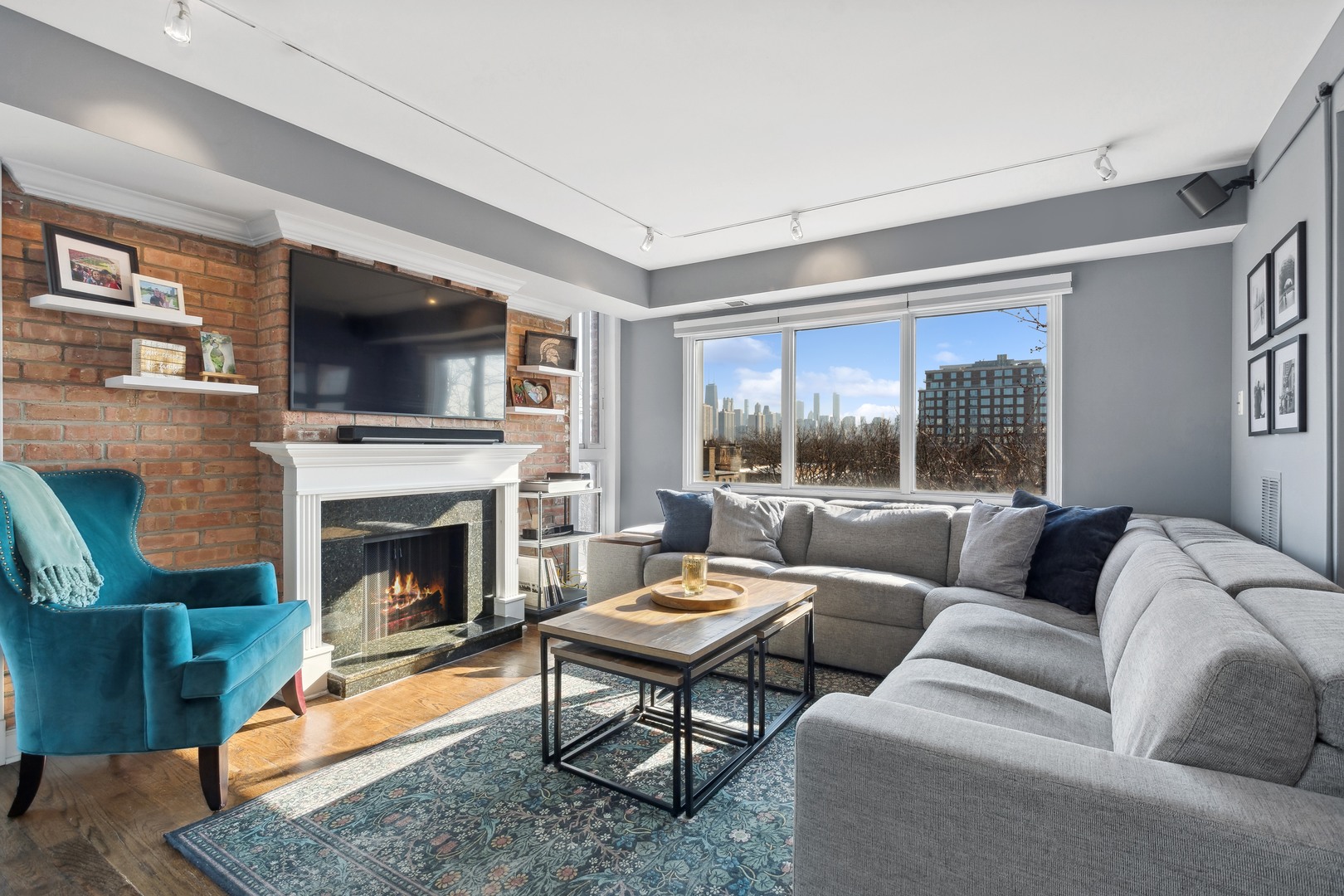 2333 North Geneva Terrace, Unit 6D Chicago, IL 60614 - Photo 3 of 15 a living room with furniture a flat screen tv and a fireplace