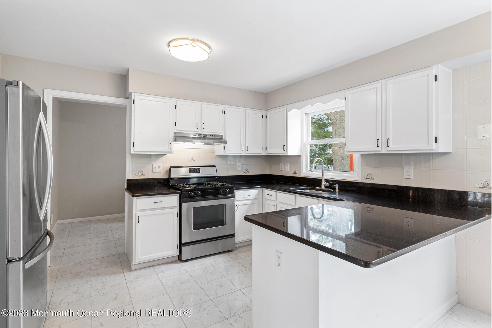 4360 Old Bridge Matawan Road Matawan, NJ 07747 - Photo 14 of 46 a kitchen with granite countertop a sink and stainless steel appliances