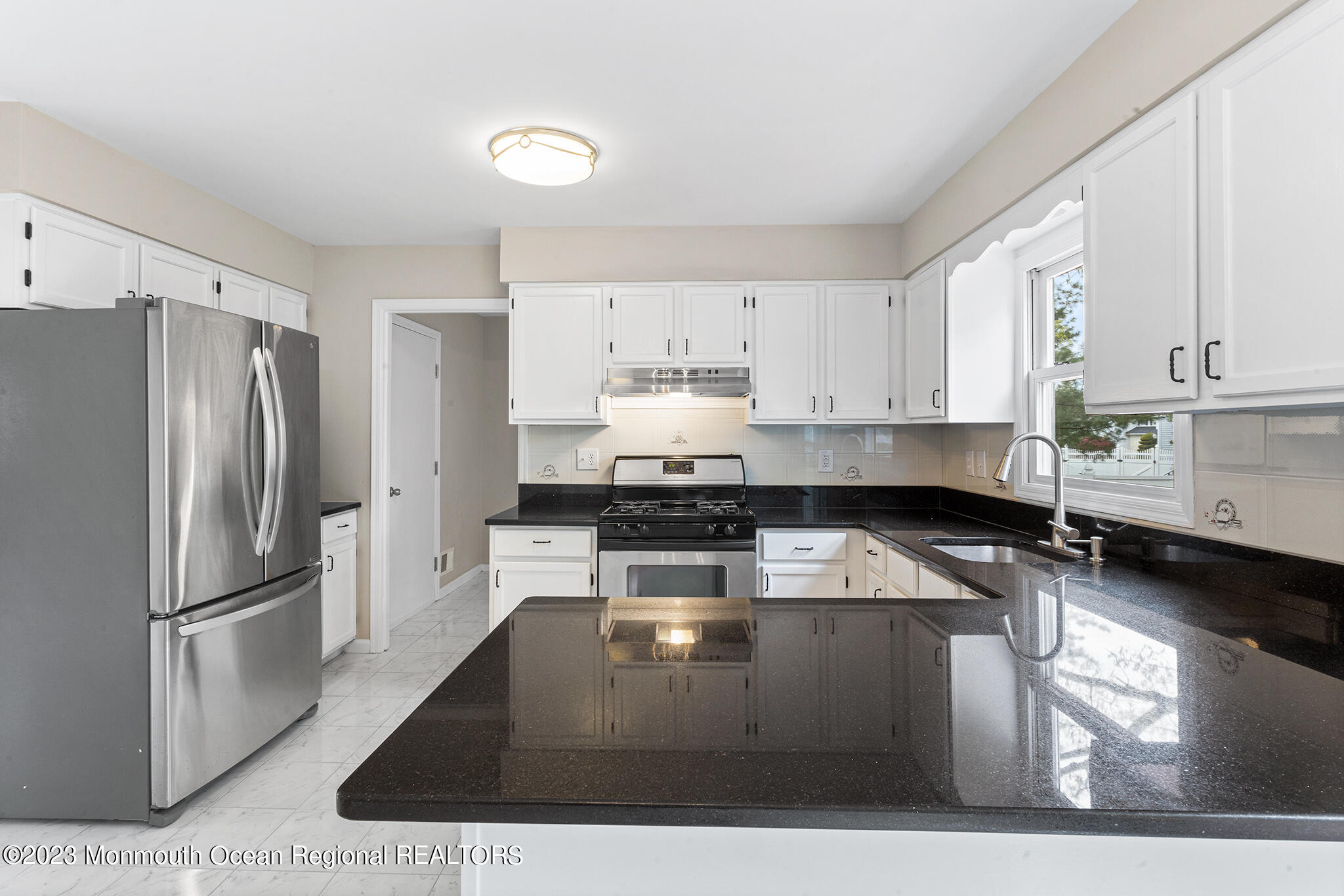 4360 Old Bridge Matawan Road Matawan, NJ 07747 - Photo 15 of 46 a kitchen with a refrigerator a stove a sink and a stove
