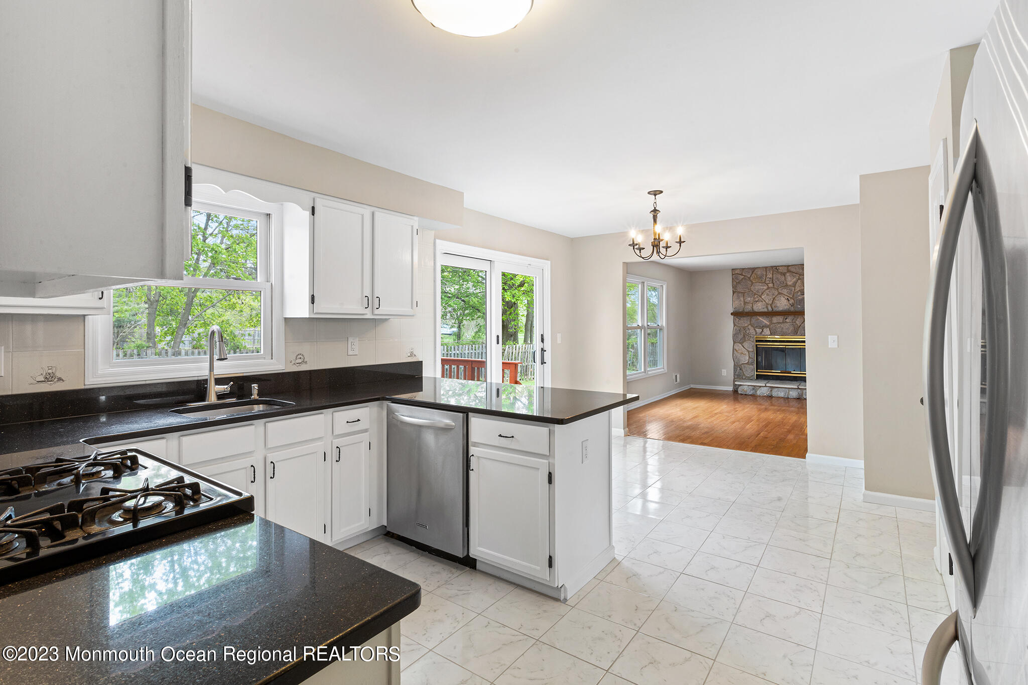 4360 Old Bridge Matawan Road Matawan, NJ 07747 - Photo 17 of 46 a kitchen with stainless steel appliances granite countertop a sink stove and refrigerator