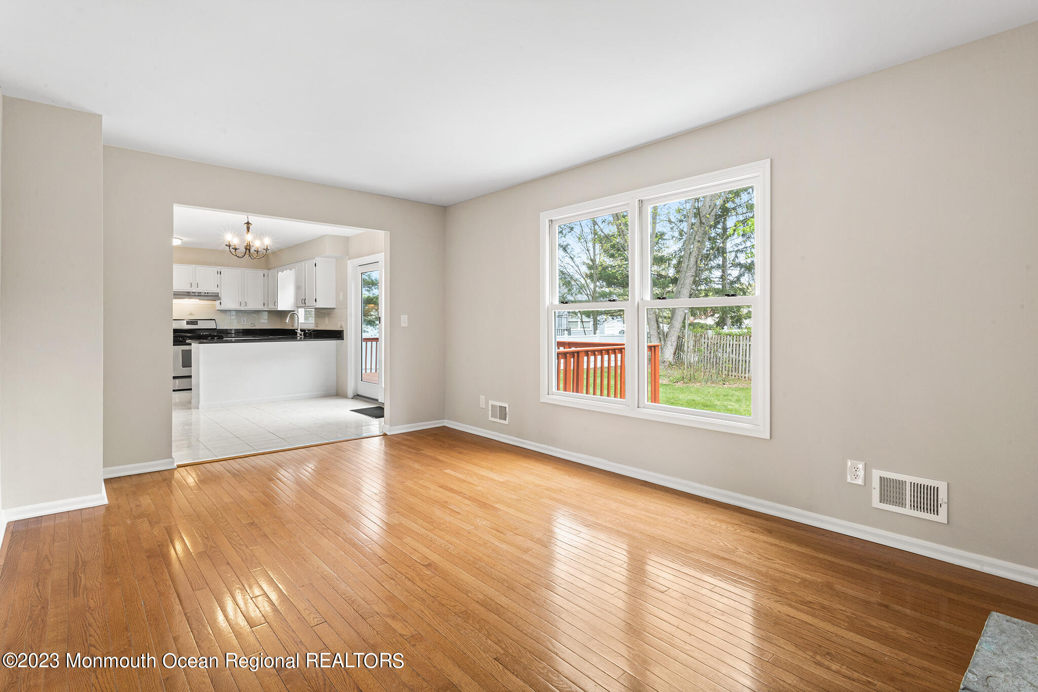 4360 Old Bridge Matawan Road Matawan, NJ 07747 - Photo 23 of 46 a view of an empty room with a window and wooden floor